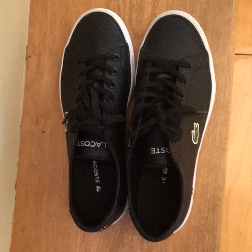 Black and white Lacoste shoes for a big boy